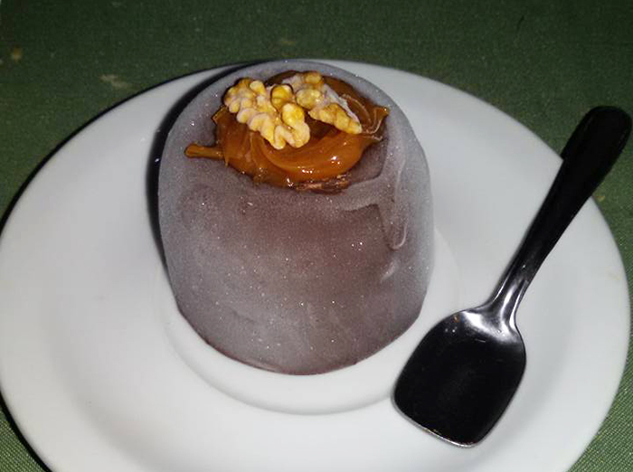  <I>Bombón suizo</I>, or a dessert featuring chocolate or vanilla ice cream filled with <I>dulce de leche</i> and sprinkled with nuts. 
